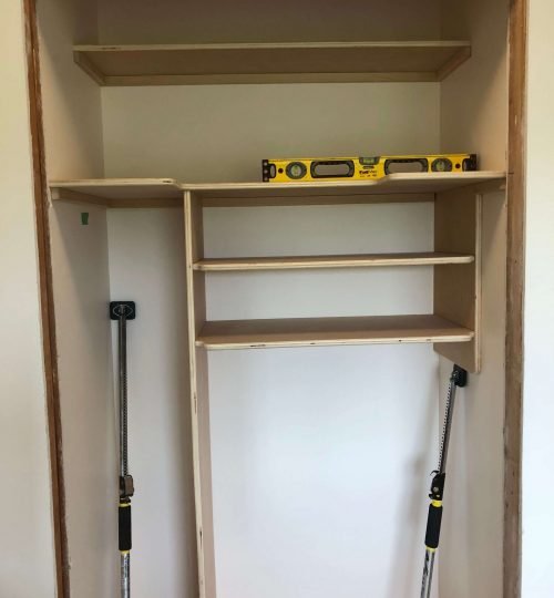 Sheets of plywood cut into custom shelves